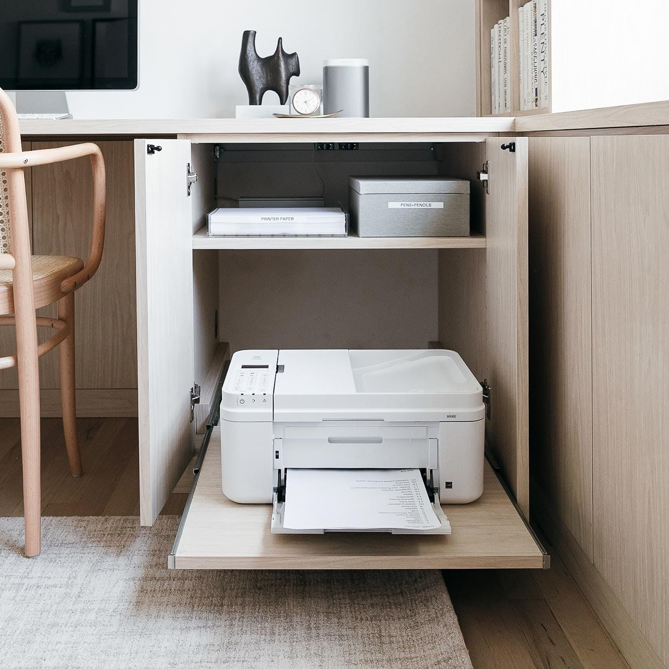 Home office custom built cabinet for printer pull out shelving by California Closets